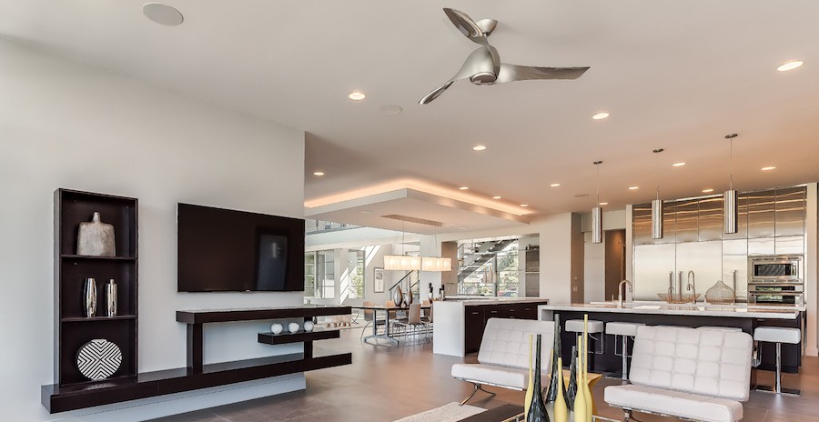 A bright, modern living room with in-ceiling whole-house audio speakers.