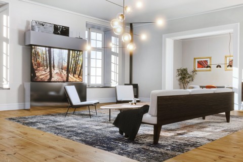 A modern living room with a high-resolution TV appearing between customized paneling by Future Automation.