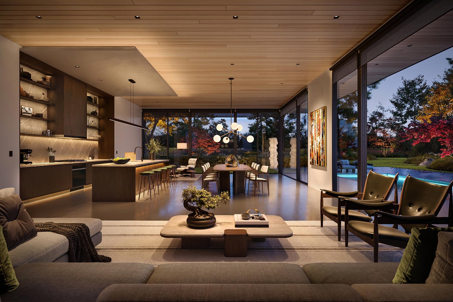Modern open-plan kitchen and living room illuminated at dusk